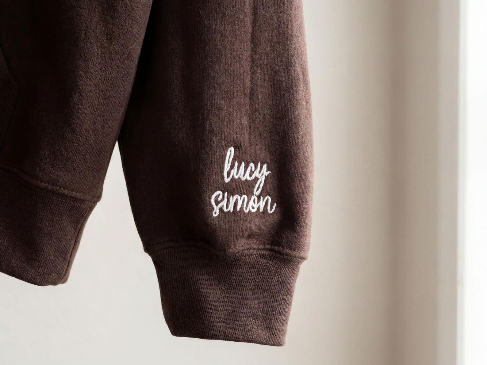 The shop's real photo of a sleeve-embroidered crewneck