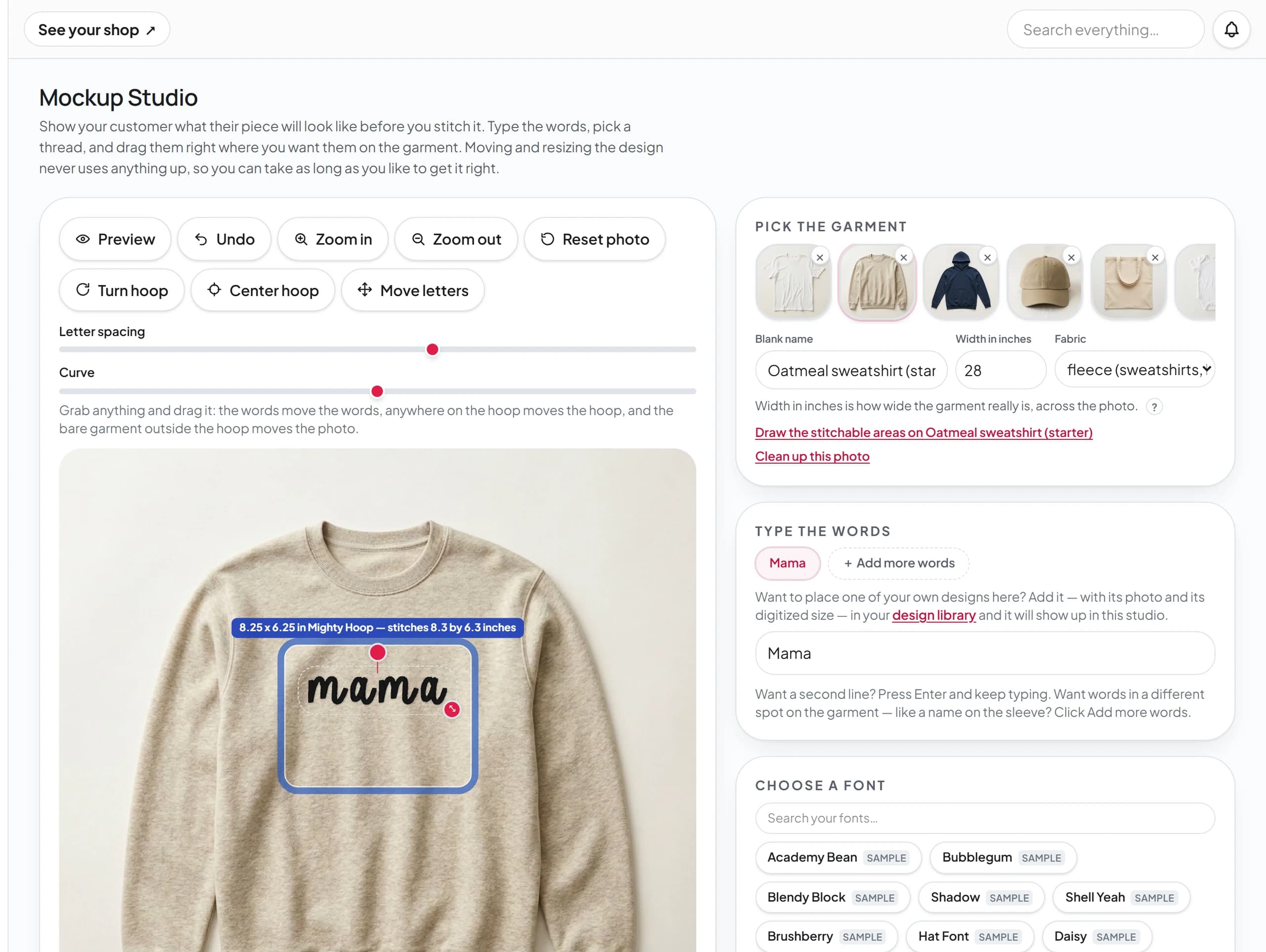 The Mockup Studio with Mama placed on an oatmeal sweatshirt in a script font, the hoop drawn over the design at 8.25 by 6.25 inches, and the garment, wording, and font panels on the right